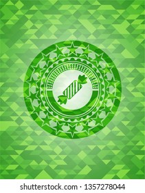 candy icon inside green emblem with triangle mosaic background