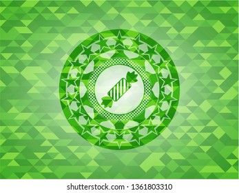 candy icon inside green emblem with triangle mosaic background