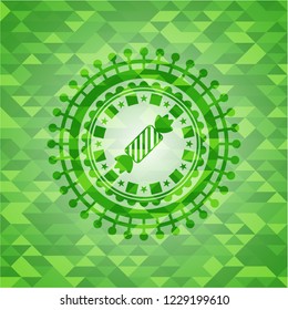 candy icon inside green mosaic emblem