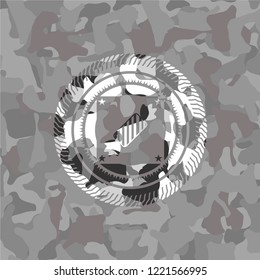 candy icon inside grey camo emblem