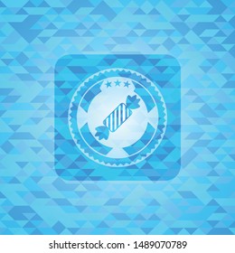 candy icon inside light blue emblem with mosaic ecological style background