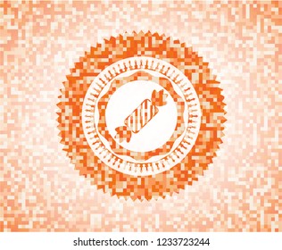 candy icon inside orange mosaic emblem