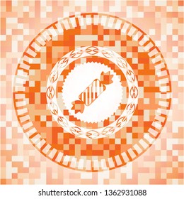 candy icon inside orange mosaic emblem
