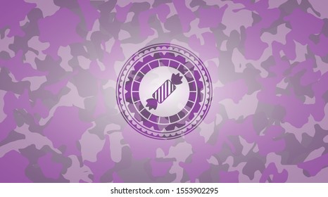 candy icon inside pink and purple camo texture