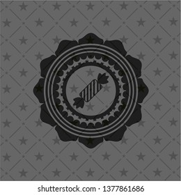 candy icon inside realistic dark emblem
