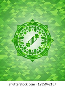 candy icon inside realistic green emblem. Mosaic background