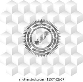 candy icon inside realistic grey emblem with geometric cube white background