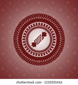 candy icon inside realistic red emblem