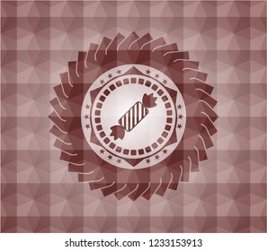 candy icon inside red seamless badge with geometric background.