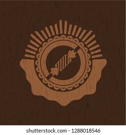 candy icon inside retro wood emblem