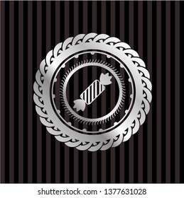 candy icon inside silver badge or emblem