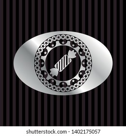 candy icon inside silver badge or emblem
