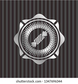 candy icon inside silver emblem