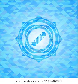 candy icon inside sky blue emblem with mosaic ecological style background