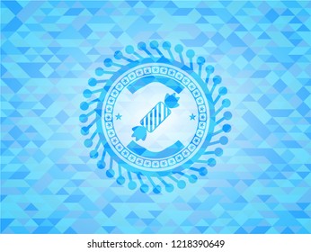 candy icon inside sky blue mosaic emblem