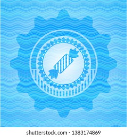 candy icon inside sky blue water emblem.