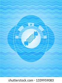 candy icon inside water concept emblem.