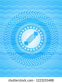 candy icon inside water emblem background.