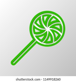 candy icon. Paper style. Cut symbol with green bold contour on shape and simple shadow