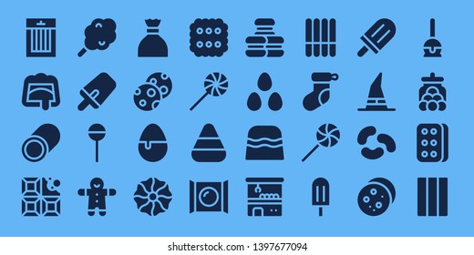 candy icon set. 32 filled candy icons. on blue background style Collection Of - Treats, Chocolate, Marshmallow, Cotton candy, Popsicle, Lollipop, Gingerbread, Sugar, Cookies,