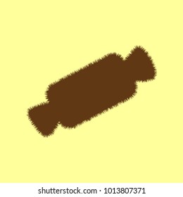 Candy icon. Vector. Brown hairy icon on yellowish background. Isolated.