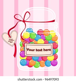 Candy jar on a pink background with heart shaped label.