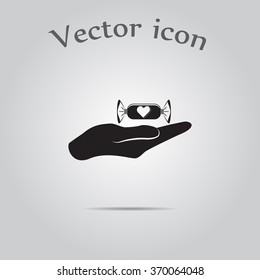 Candy on hand - Valentine's Day vector icon