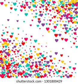 Candy of red, yellow, blue and purple hearts on a white background. Flying confetti from hearts. Valentine's day card.