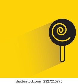 candy with shadow on yellow background