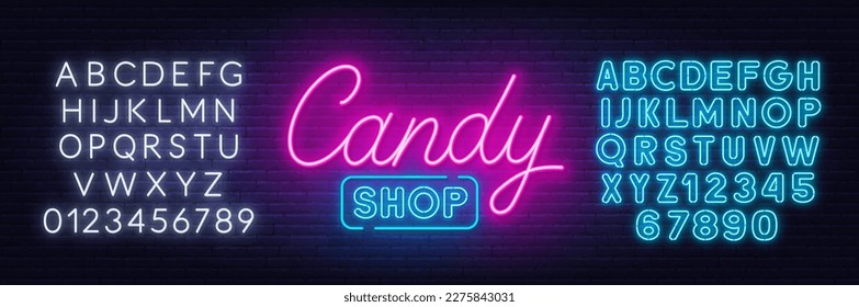 Candy Shop neon sign on brick wall background.