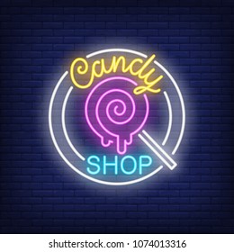 Candy shop neon sign. Pin-up lollipop on stick in circle on brick wall. Night bright advertisement. Vector illustration in neon style for cafe and confectionery