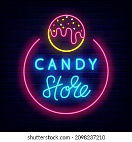 Candy Shop Neon Signboard. Cake Pop With Sprinkles Shiny Icon. American Tasty Ball. Sweet Store Logo. Bakery Emblem. Night Bright Sign On Brick Wall Background. Vector Stock Illustration