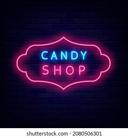 Candy shop neon signboard in vintage frame. Sweet store logo. Bakery emblem. Night bright sign on brick wall background. Vector stock illustration