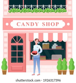 Candy shop vector illustration. Cartoon woman seller character holding chocolate cake in plate and standing at entrance to pastry shop, confectionery retro store facade with sweet desserts at showcase