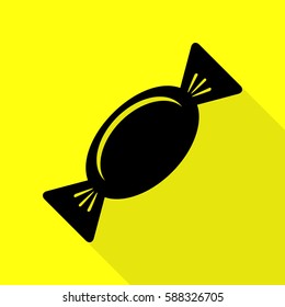 Candy sign illustration. Black icon with flat style shadow path on yellow background.