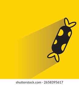 candy toffy icon with shadow on yellow background