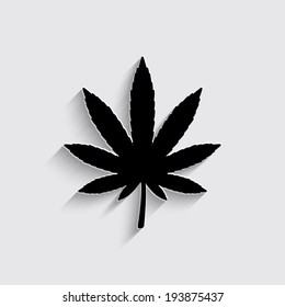 cannabis leaf silhouette with shadow on a grey background