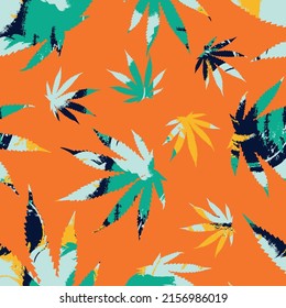 El cannabis deja un patrón impecable sobre el fondo naranja. 