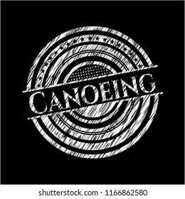 Canoeing chalk emblem written on a blackboard