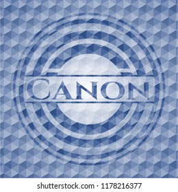 Canon blue emblem or badge with abstract geometric pattern background.