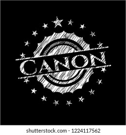 Canon chalkboard emblem on black board