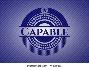 Capable badge with denim background