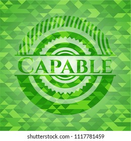 Capable green emblem with mosaic background