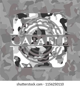 Capable on grey camouflage texture