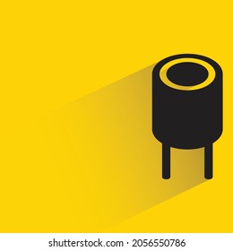 capacitor with shadow on yellow background