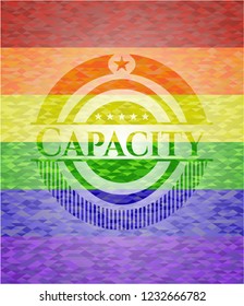 Capacity emblem on mosaic background with the colors of the LGBT flag