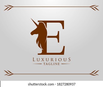 Capital Letter E with a Unicorn. Royal Logo. King Stallion in Jump. Unicon Letter Icon. Stylish Graphic Template Design