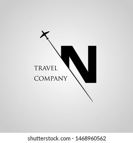 Capital N letter is inserted in the paper slot with the plane slice letter N for travel logo.