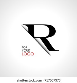 Capital r letter is inserted in the paper slot. To create logos, emblems, monograms