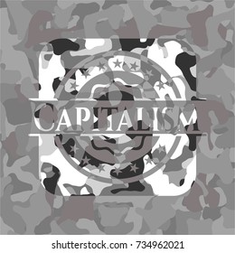 Capitalism on grey camouflaged texture